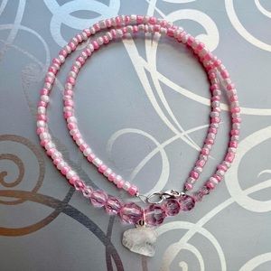 Pink and white beaded necklace with quartz charm